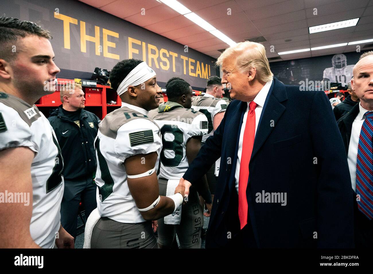 President Donald J. Trump, joined by Secretary of Defense Mark Esper, meets  with members of the U.S. Army football team in their locker room prior to  the start of the 120th Army-Navy