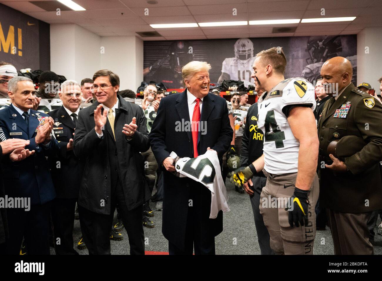 President Donald J. Trump, joined by Secretary of Defense Mark Esper, meets with members of the U.S. Army football team in their locker room prior to the start of the 120th Army-Navy football game at Lincoln Financial Field in Philadelphia, Pa. President Trump at the Army-Navy Football Game Stock Photo