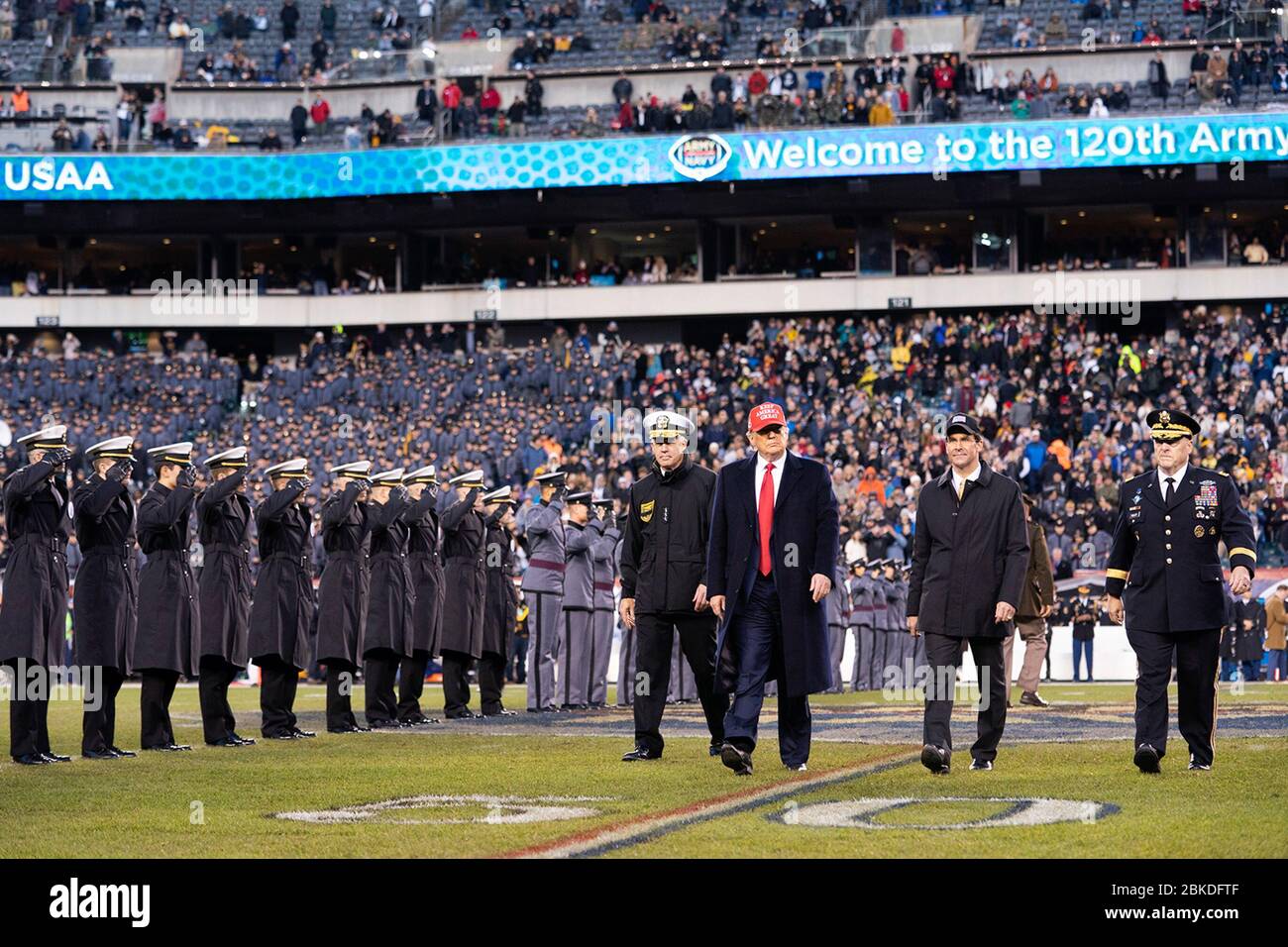 President Donald J. Trump is joined by Secretary of Defense Mark Esper and Joint Chiefs of Staff Chairman Gen. Mark Milley, right, as walks across the field during the 120th Army-Navy football game at Lincoln Financial Field in Philadelphia, Pa. President Trump at the Army-Navy Football Game Stock Photo