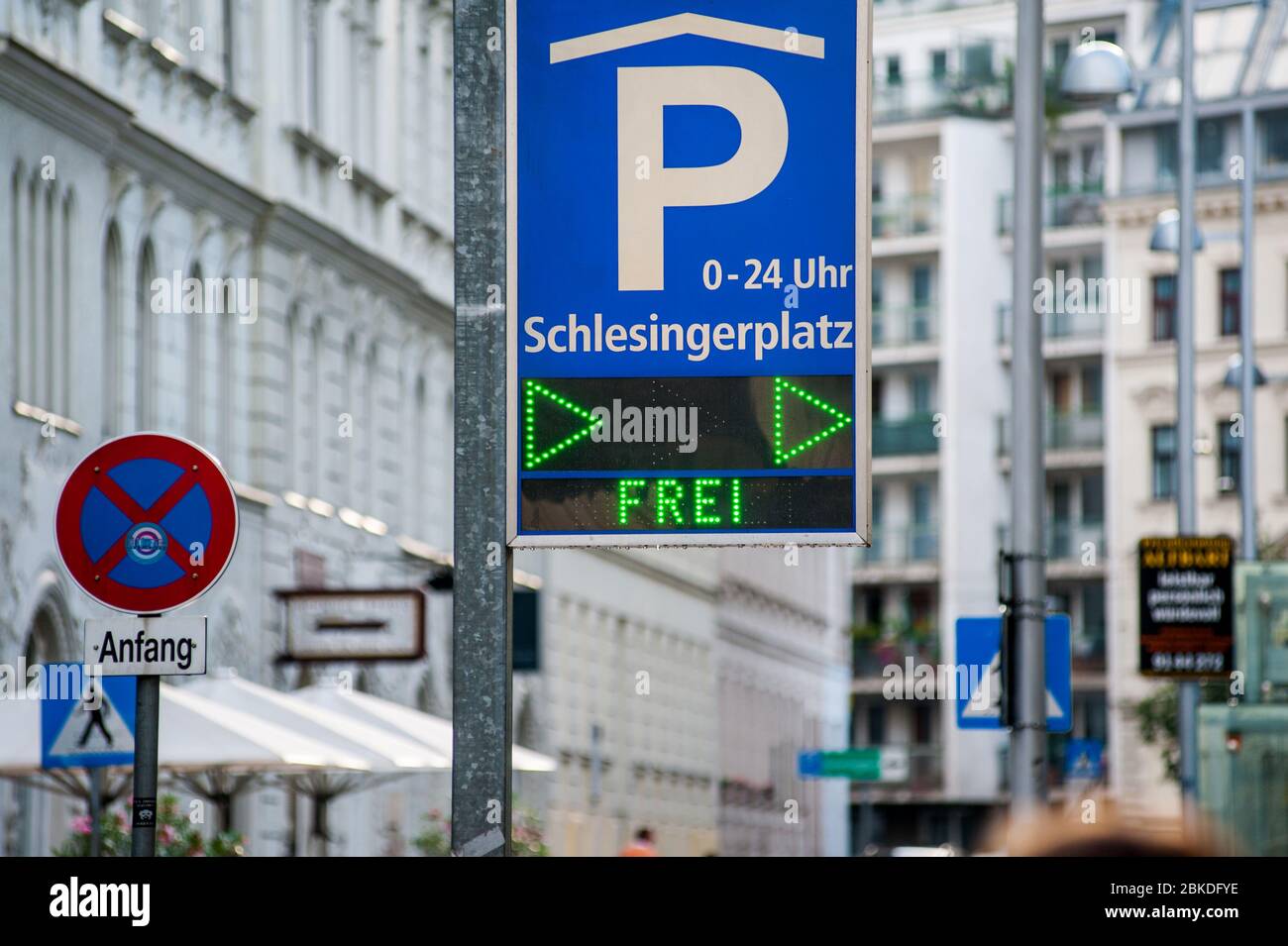 Parking covered place street sign on Schlesingerplatz square with Free