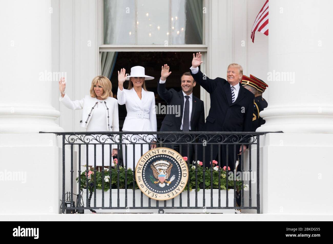 The President of France and Mrs. Macron were welcomed during an official state visit ceremony, marking the commencement of diplomatic discussions and engagements between France and the host country. Stock Photo