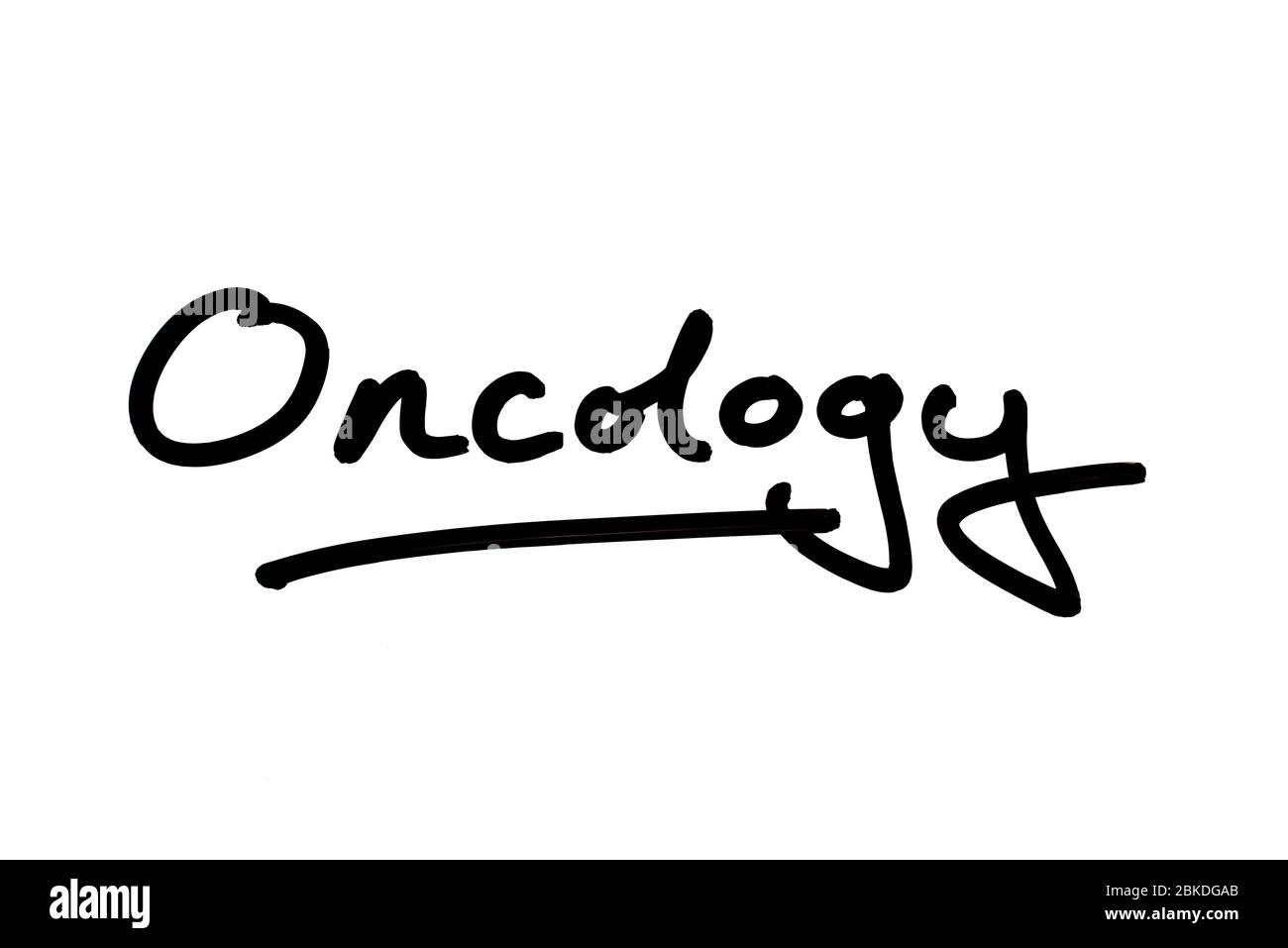 Oncology handwritten on a white background. Stock Photo