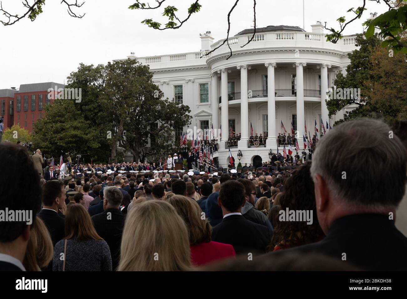 The President of France, along with Mrs. Macron, arrives for their official state visit. The arrival ceremony marks the beginning of a diplomatic visit, emphasizing bilateral relations and collaboration between the two nations. Stock Photo