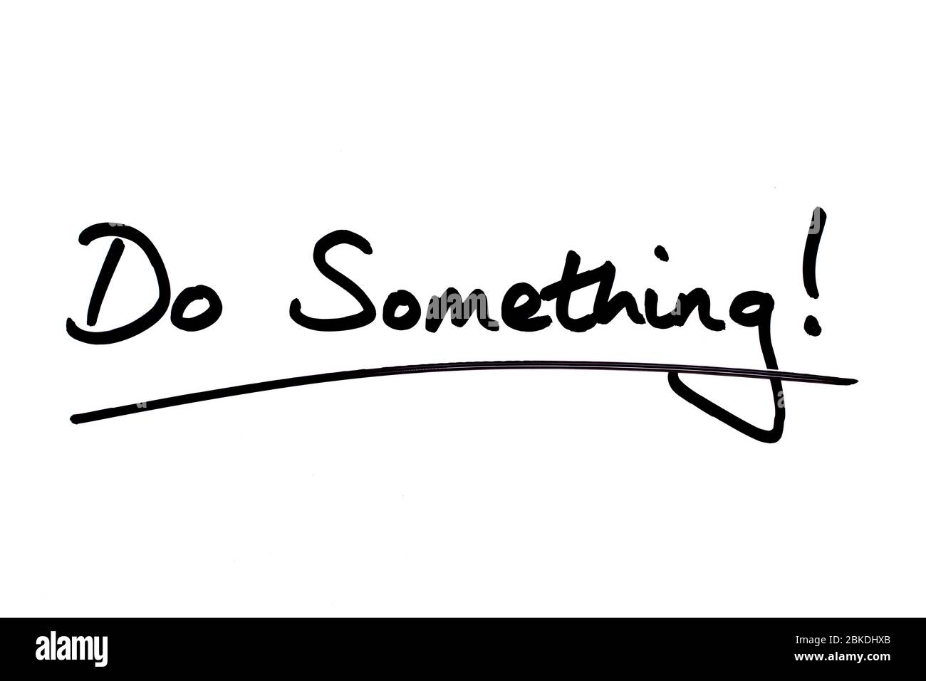 Do Something! handwritten on a white background. Stock Photo