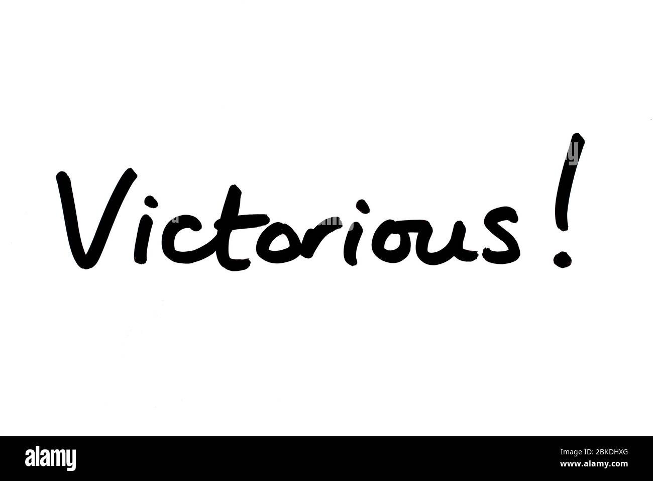 Victorious! handwritten on a white background. Stock Photo