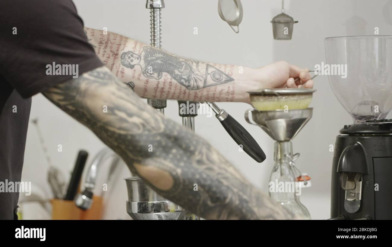 Barista With A Tattoo Prepares Lemon Natural Juice In A Bottle For Making A Summer Drink Slow Motion Full Hd Video 240fps 1080p Stock Photo Alamy