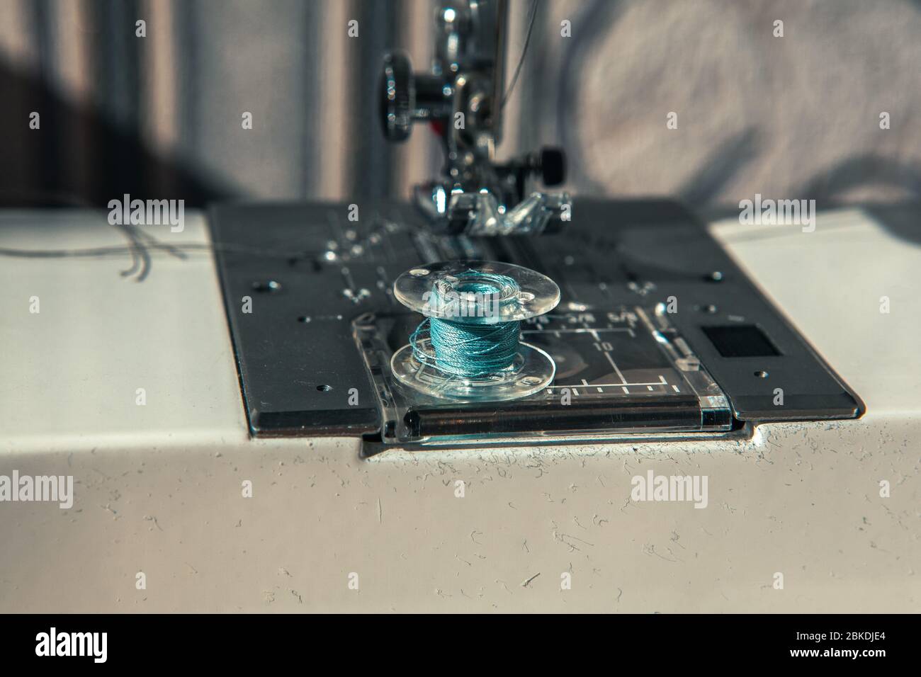 sewing machine and spool with thread Stock Photo Alamy