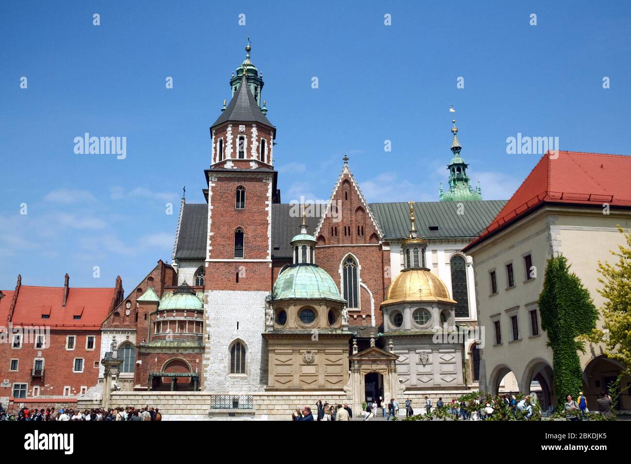 KRAKOW, POLAND - JUNE 6, 2009: Saints peter and paul church in Krakow with tourists entering. Also called kosciol swietych apostolow piotra i pawla, i Stock Photo