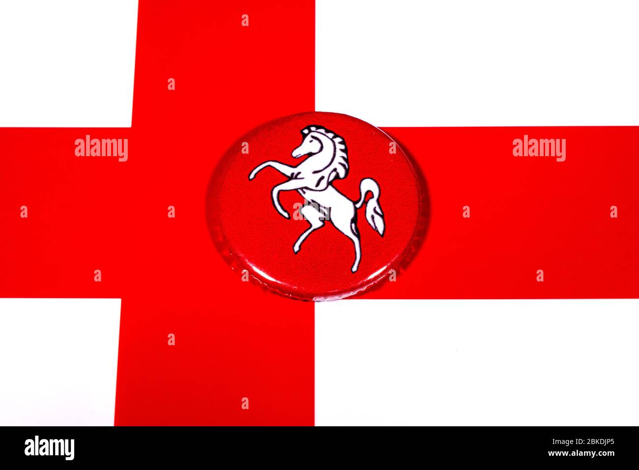 A badge portraying the flag of the English county of Kent pictured over the England flag. Stock Photo