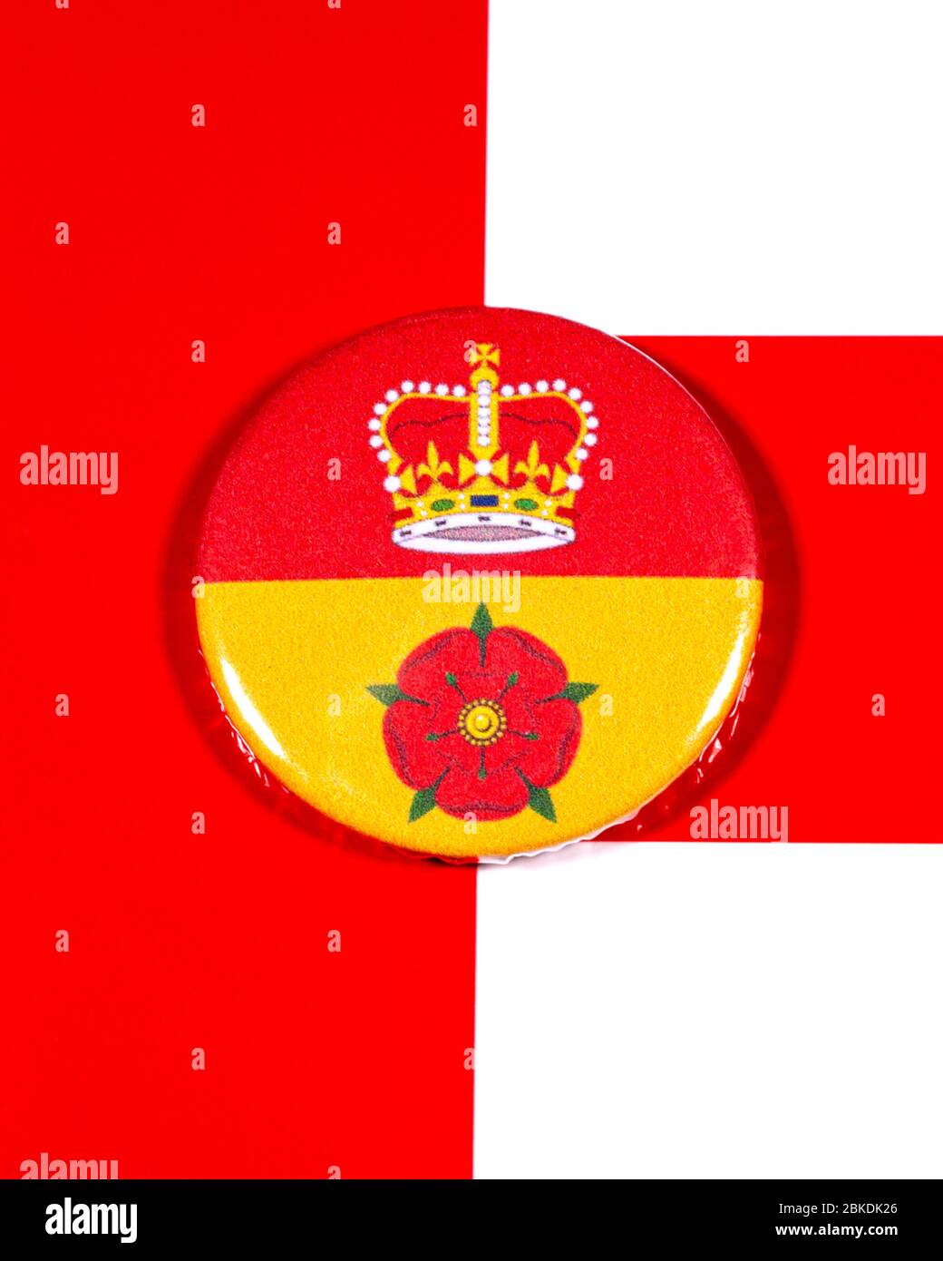 A badge portraying the flag of the English county of Hampshire pictured over the England flag