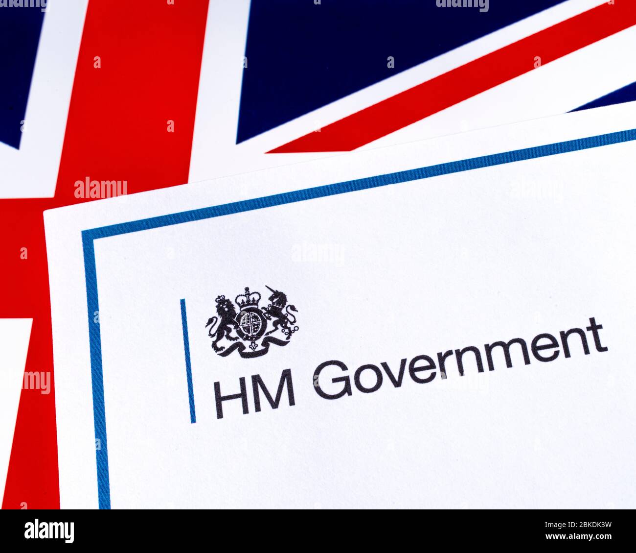 London, UK - April 20th 2020: HM Government heading with a UK flag background. Stock Photo