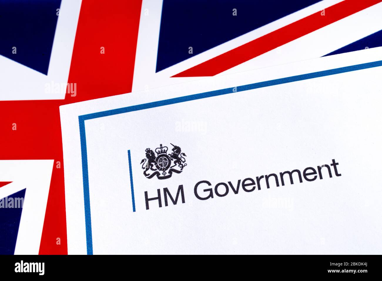 London, UK - April 20th 2020: HM Government heading with a UK flag background. Stock Photo