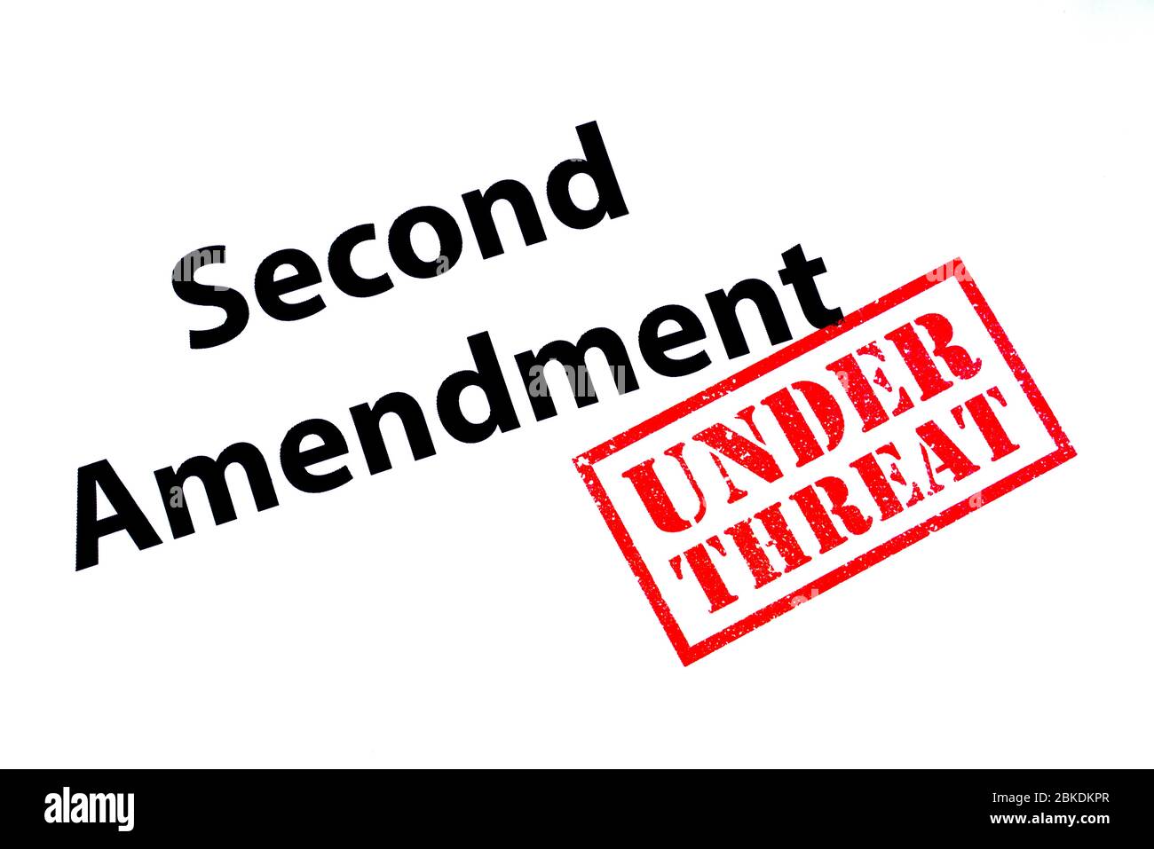 Second Amendment heading with a red UNDER THREAT rubber stamp. Stock Photo