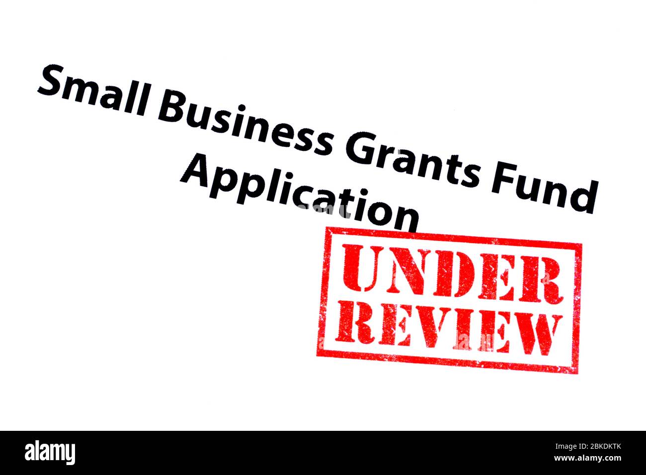 Small Business Grants Fund Application Heading With A Red Under Review Rubber Stamp Stock Photo Alamy