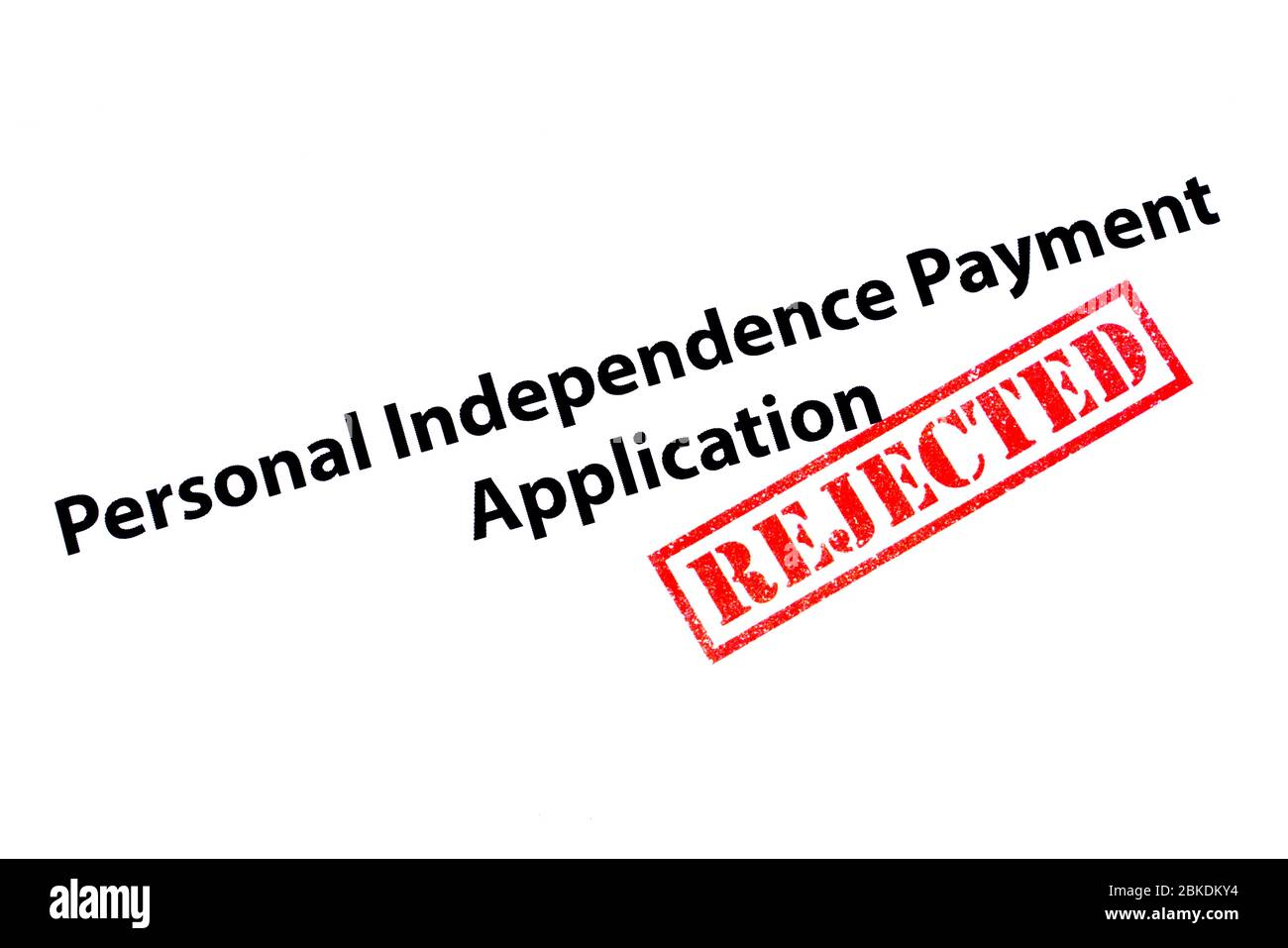 Personal Independence Payment Application heading with a red REJECTED rubber stamp. Stock Photo