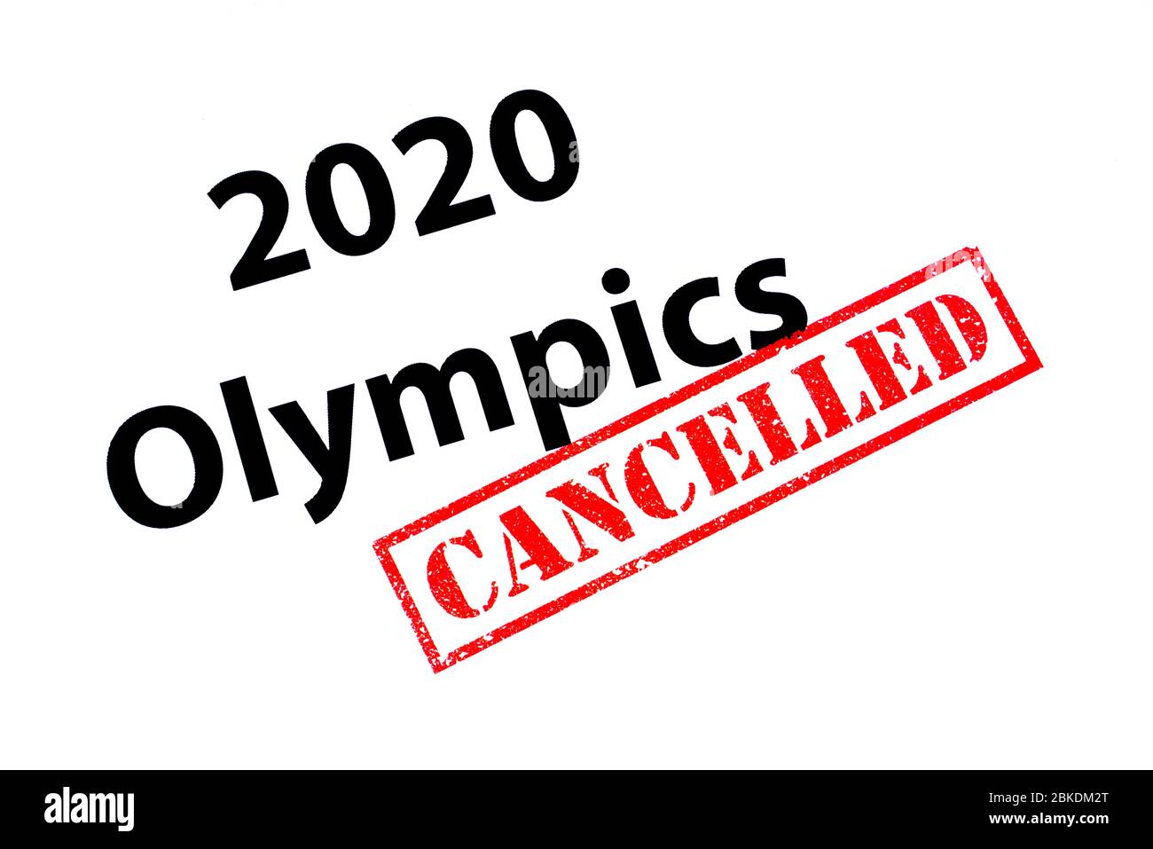 2020 Olympics heading with a red CANCELLED rubber stamp. Stock Photo