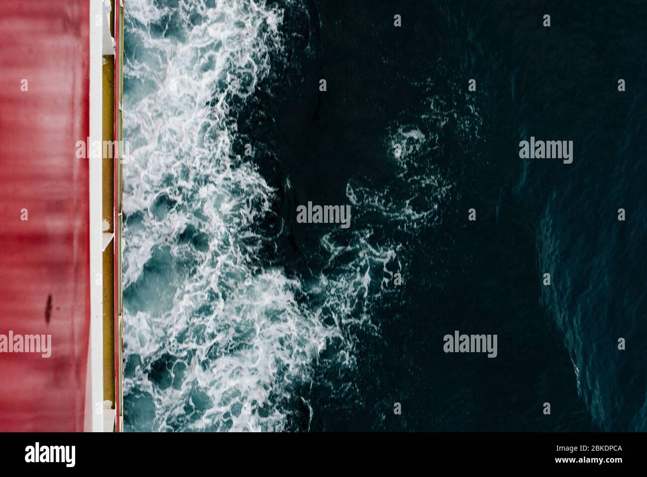 Abstract top view of a bow wave made by a ship at sea. selective focus Stock Photo