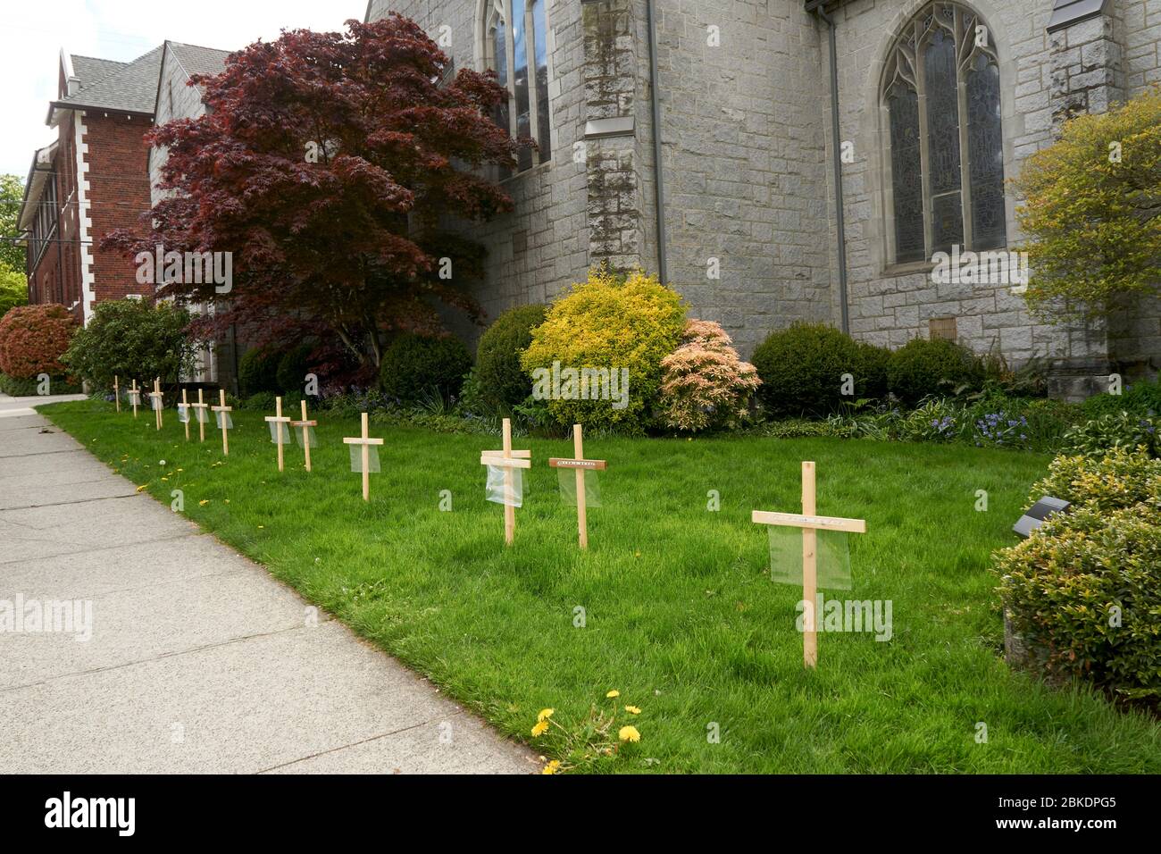 Vancouver, Canada, May 3,l 2020. A row of wooden crosses outside a church honor people who have died during the COVD-19 pandemic. Stock Photo