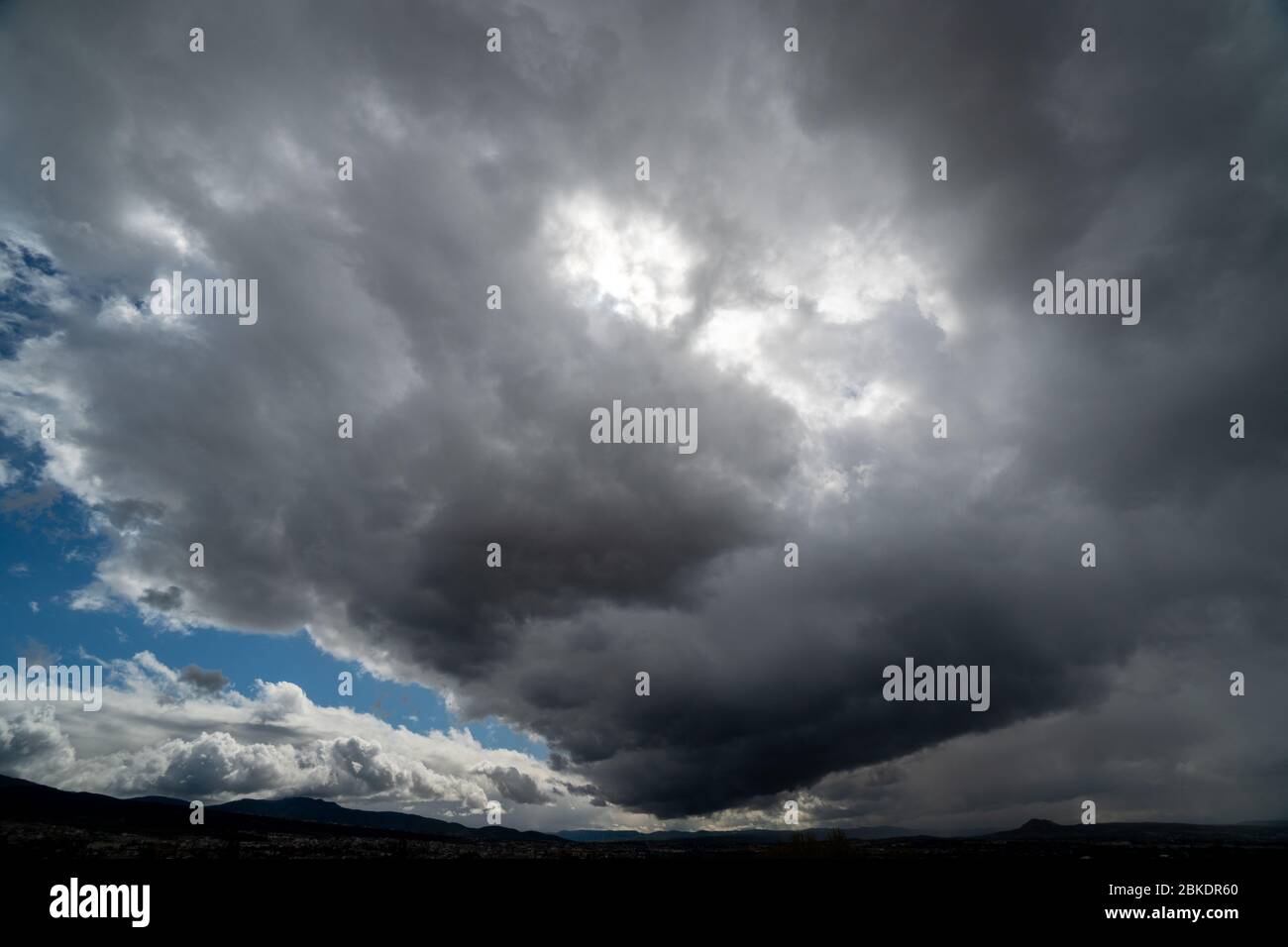 Dark and Dramatic Storm Clouds Area Background Stock Photo
