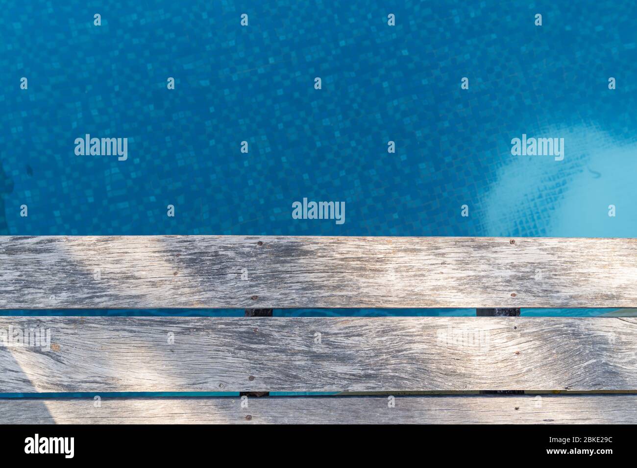 Wooden pathway on the swimming pool. Close up. Stock Photo