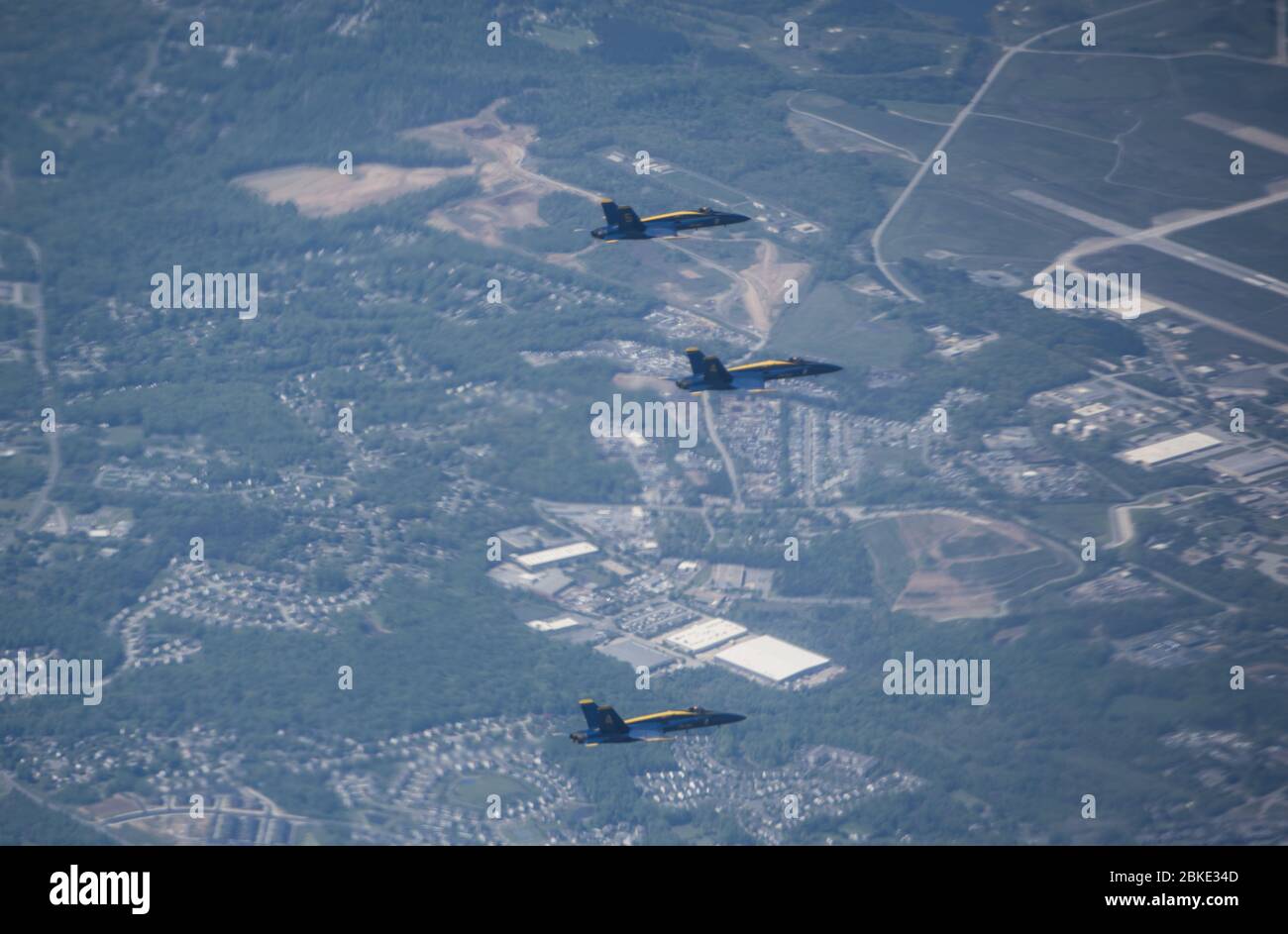 The U.S. Navy Blue Angels conduct a flyover as part of the America Strong campaign in Washington DC, May 2, 2020. The demonstration team conducted flyovers alongside the U.S. Air Force Thunderbirds to honor healthcare workers, first responders, and other essential personnel who are working on the front lines to combat COVID-19. (U.S. Air Force photo by Senior Airman Ariel Owings) Stock Photo