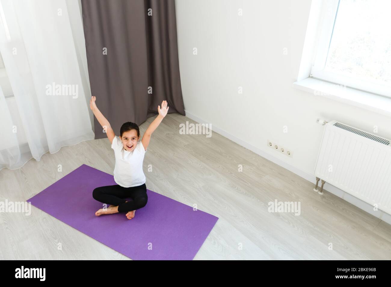 little girl practices yoga at home Stock Photo - Alamy