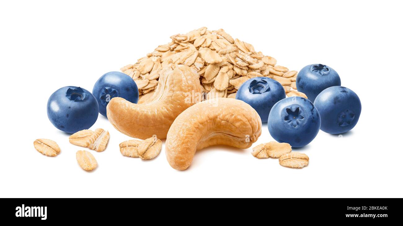 Blueberries, cashew and oat flakes isolated on white background. Oatmeal ingredients. Package design element with clipping path Stock Photo