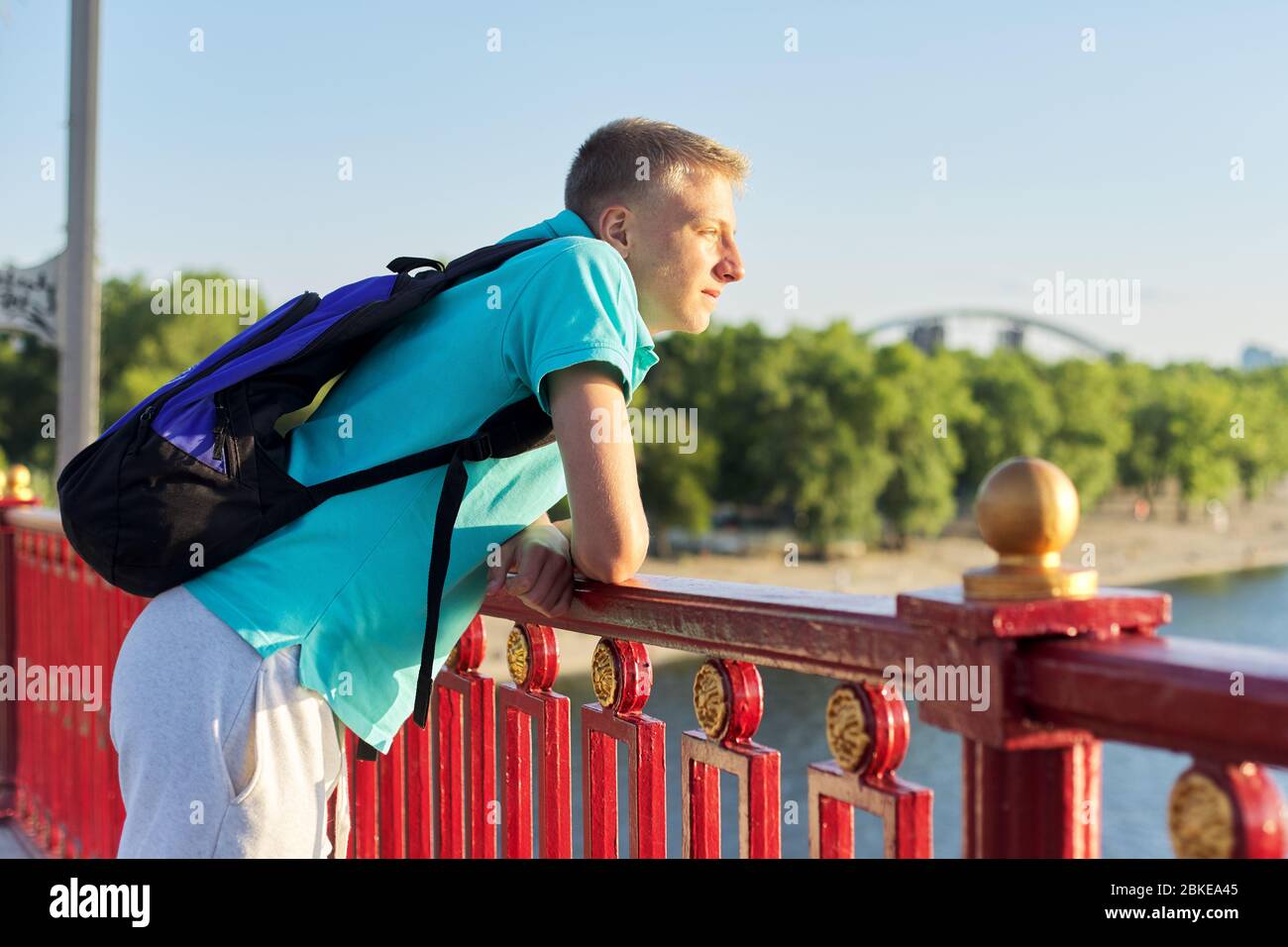 Outdoor portrait of handsome teenager boy 15, 16 years old, with copy