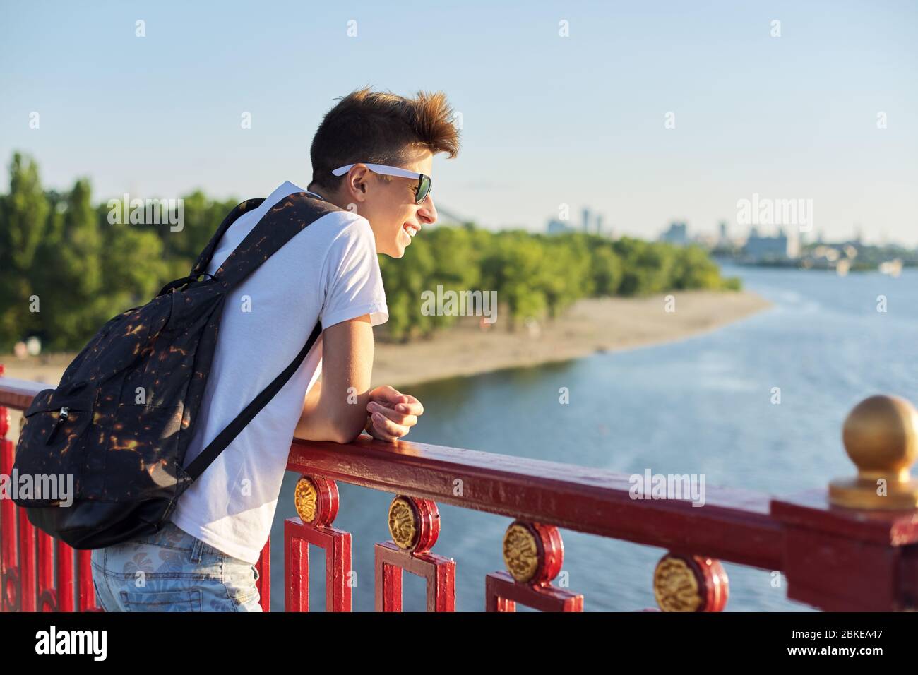 Outdoor portrait of handsome teenager boy 15, 16 years old, with copy