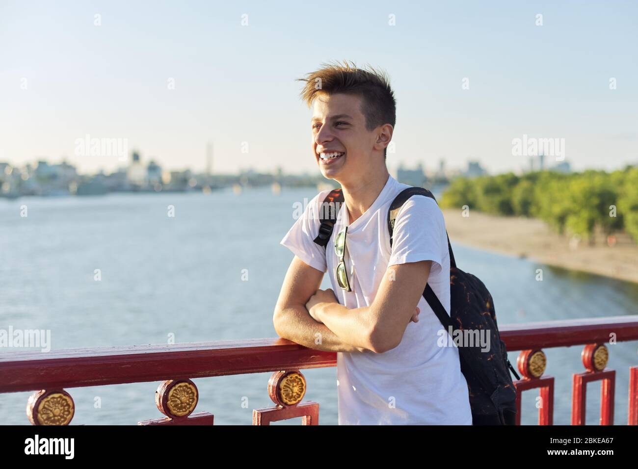 Outdoor portrait of handsome teenager boy 15, 16 years old, with copy