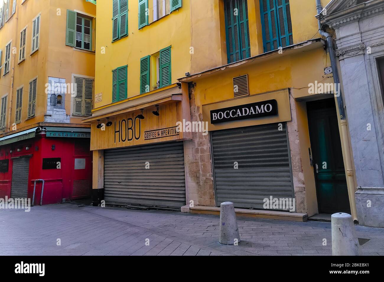 Closed shops and restaurants in colorful old buildings in the historical center of Nice, French Riviera, southern France. Stock Photo