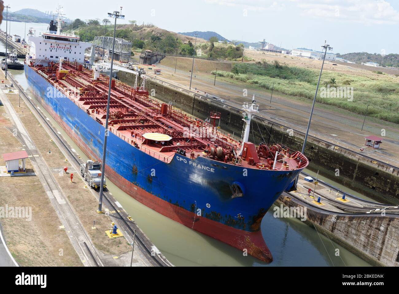 French registered vessel bow ship entering the Miraflores locks at Panama canal, Panama Stock Photo