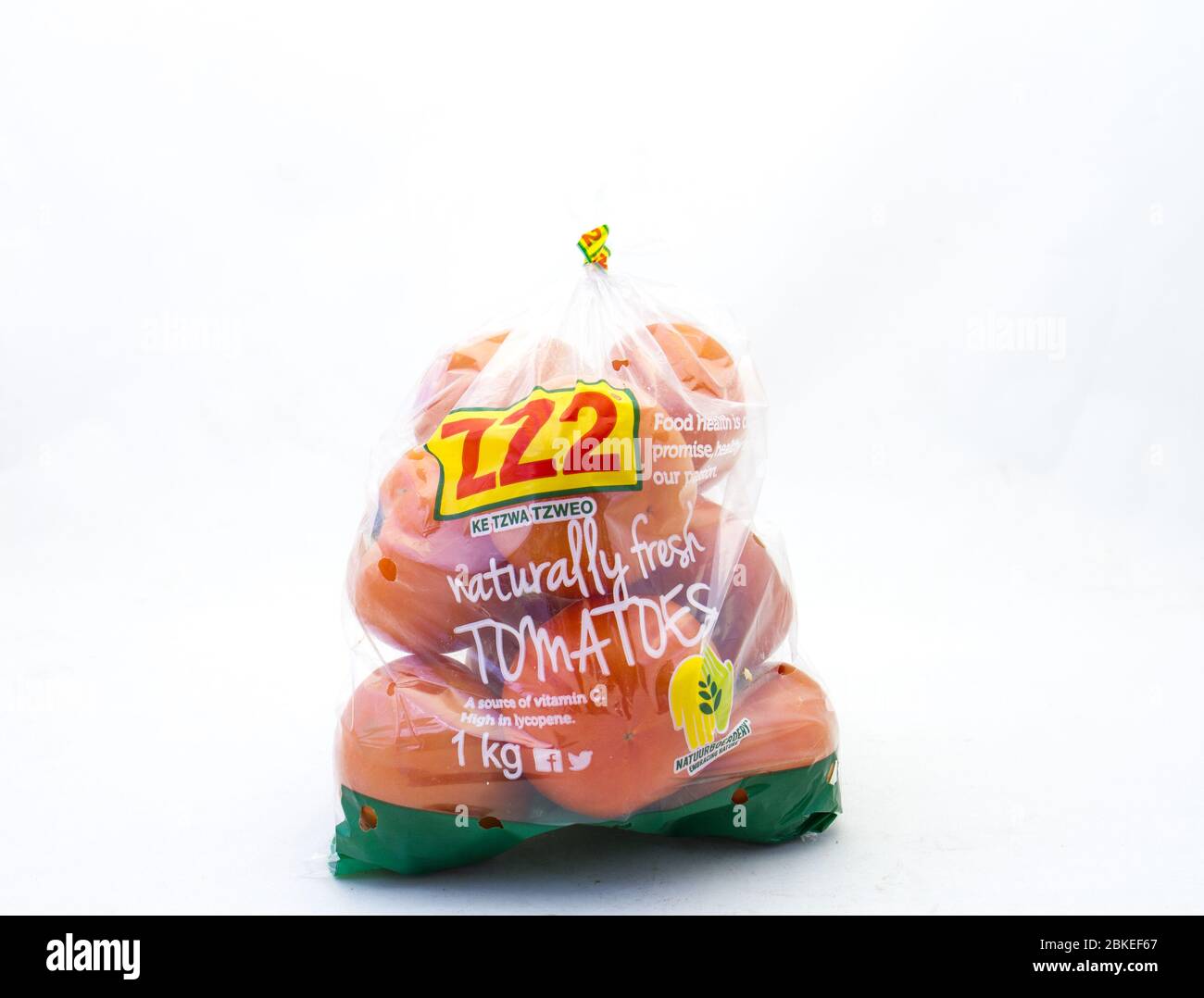 Alberton, South Africa - a bag of Z22 fresh raw tomatoes isolated on a clear background image with copy space in horizontal format Stock Photo