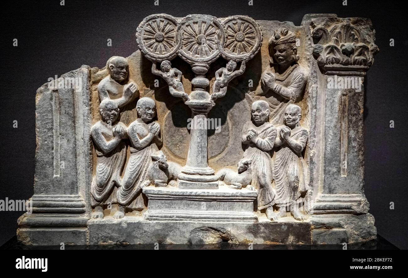 The Life of Buddha: First Sermon, stone carving, Kushan dynasty, 2nd - 3rd century, Gandhara, Pakistan Stock Photo