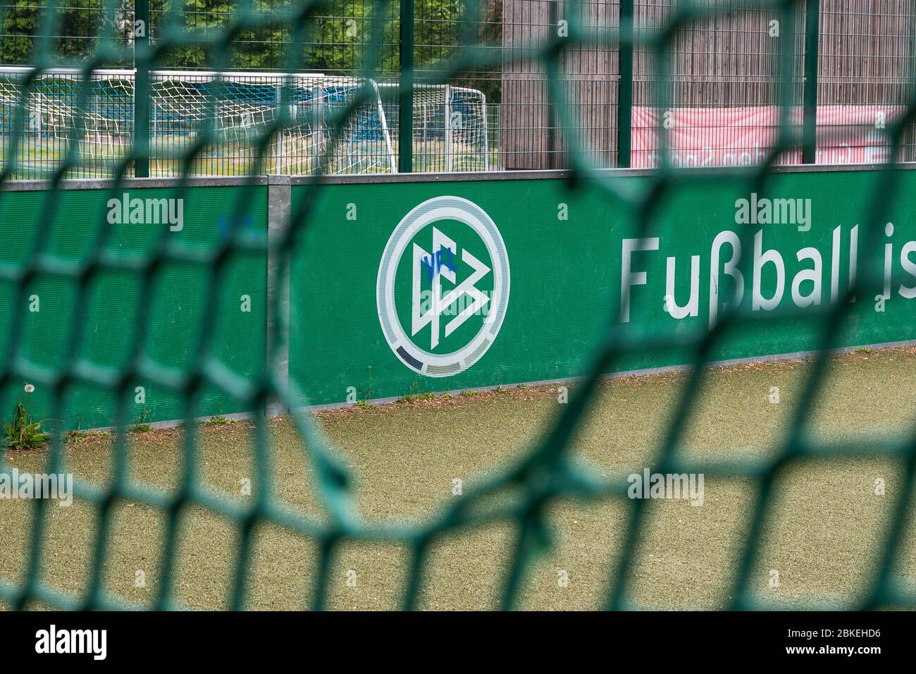 04 May North Rhine Westphalia Herdecke The Logo Of The German Football Association Dfb Can Be Seen Through A Hole In The Goal Net Of An Artificial Turf Mini Pitch On The Grounds