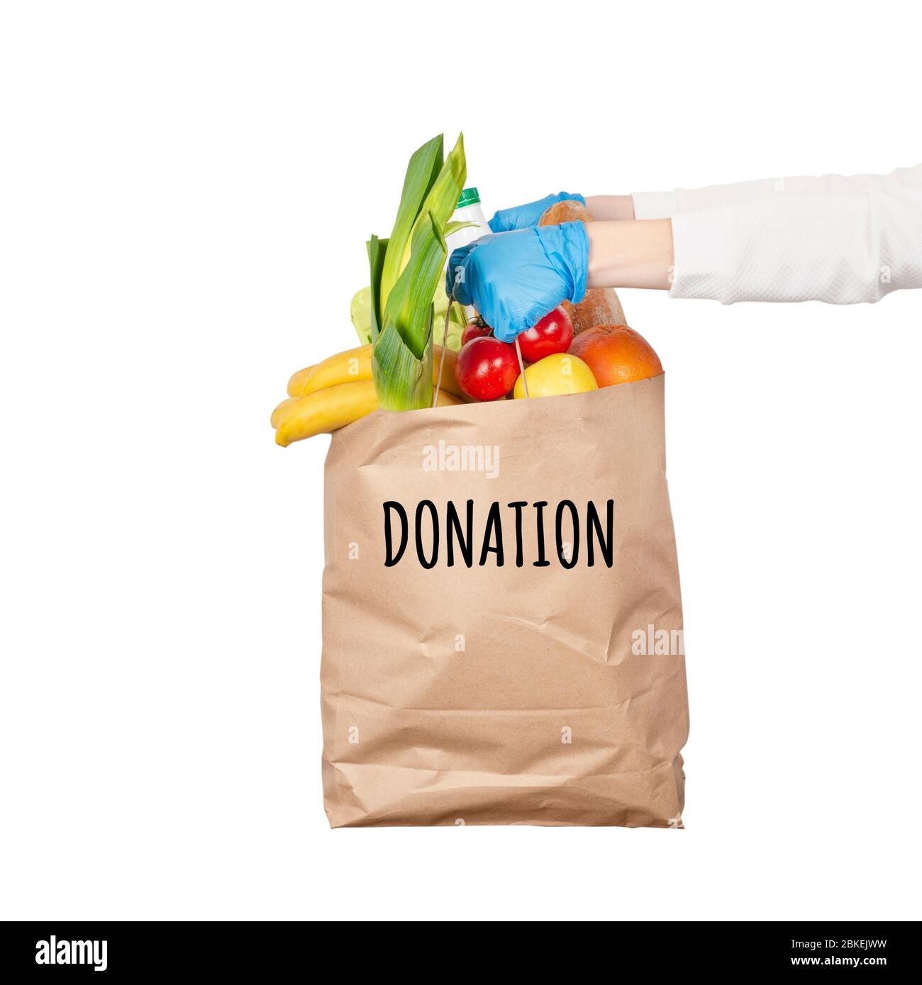 Safe food delivery or donation concept. Food delivery during coronavirus quarantine. Paper bag with different food ingredients such as fruits, vegetab Stock Photo