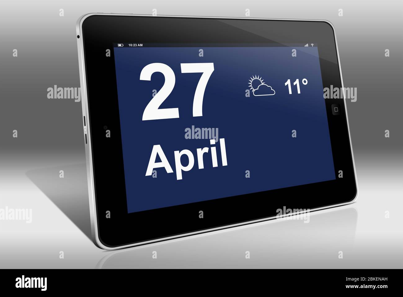 A tablet computer displays a calendar in German language with the date April 27th | Ein Tablet-Computer zeigt das Datum 27. April Stock Photo