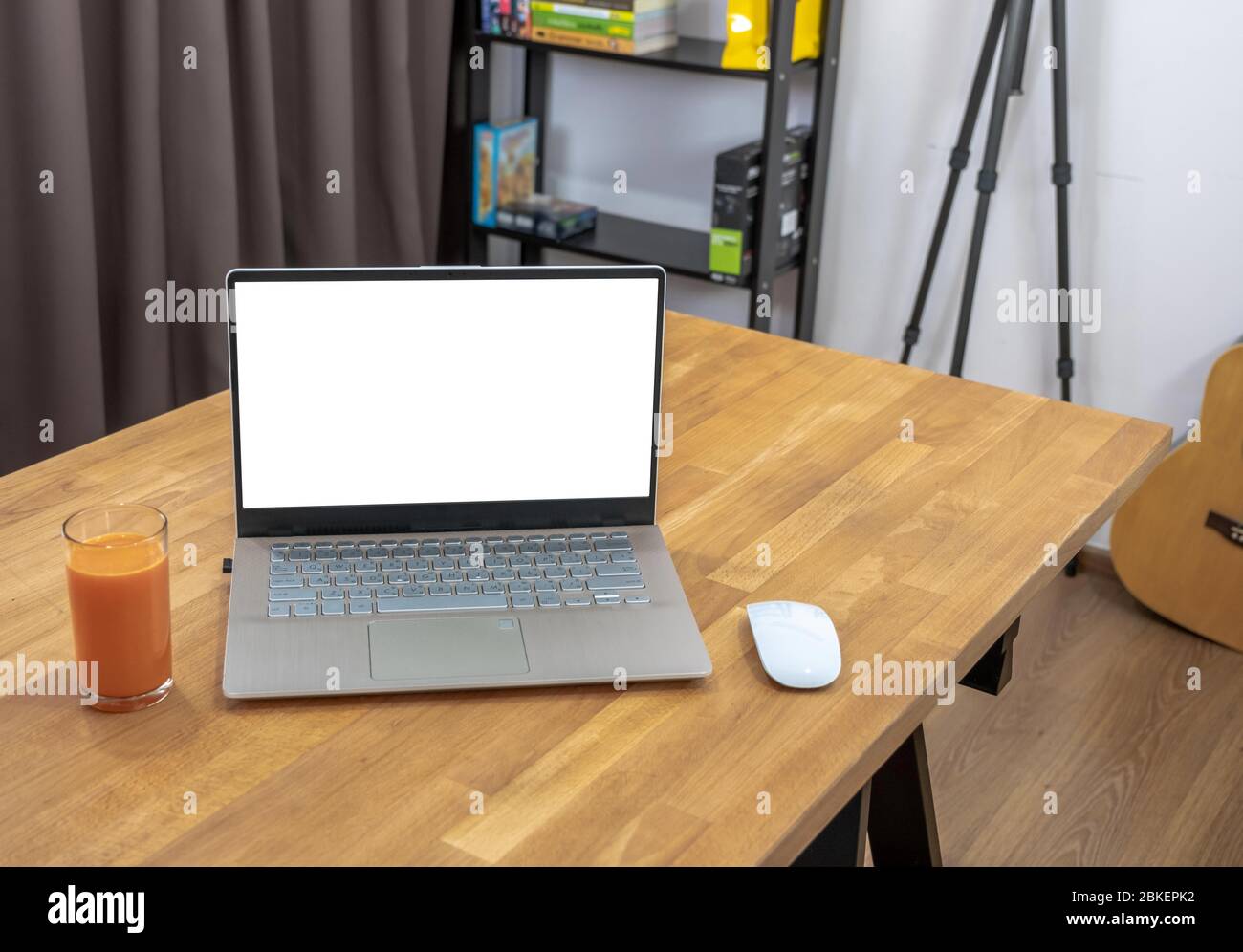 Remotely working at home office in your room.A laptop computer with copy space  on the table.You can create your workplace at your house. Stock Photo