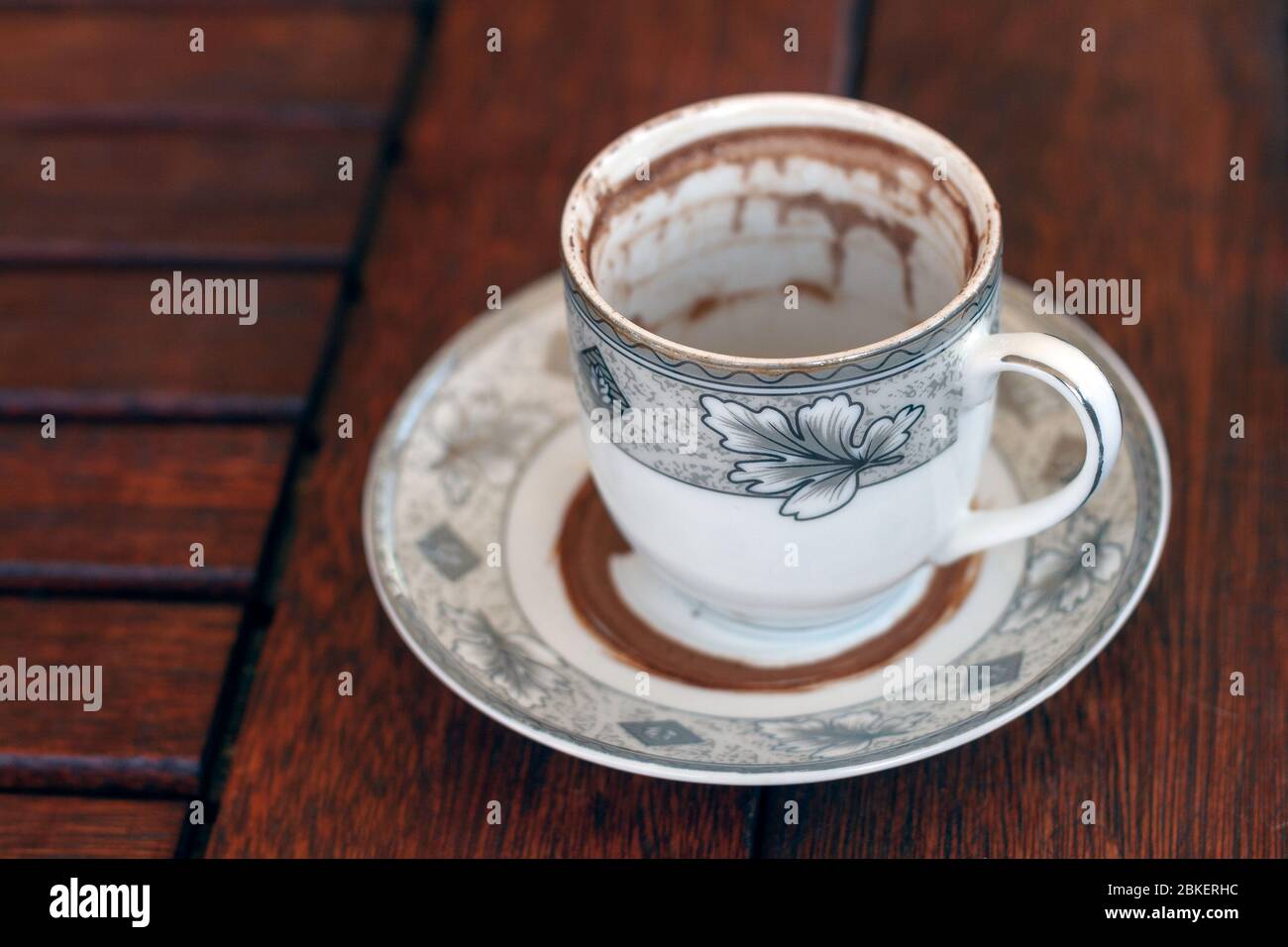 Finished Cup of Turkish Coffee on wooden background waiting for fortune telling Stock Photo