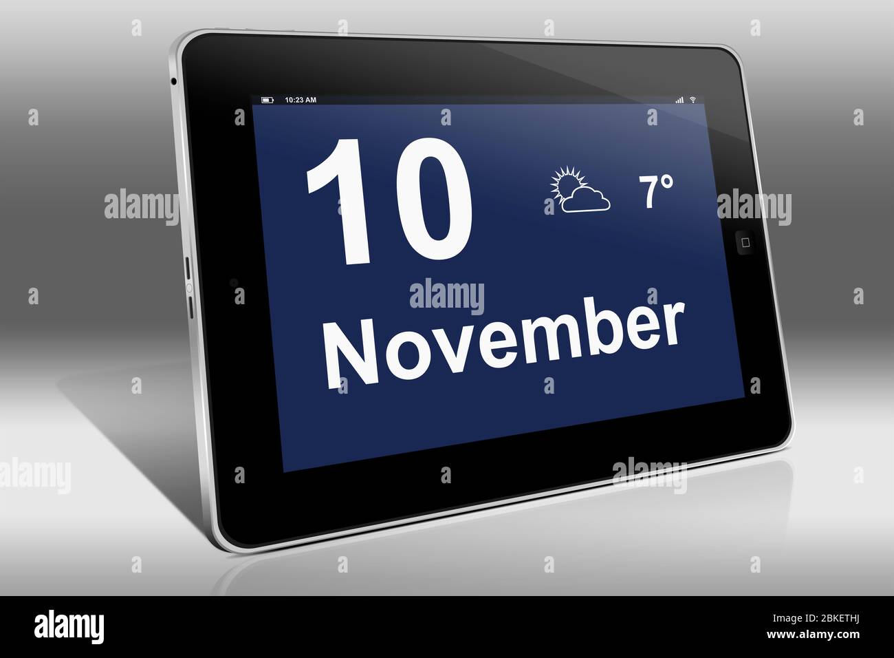 A tablet computer displays a calendar in German language with the date November 10th | Ein Tablet-Computer zeigt das Datum 10. November Stock Photo