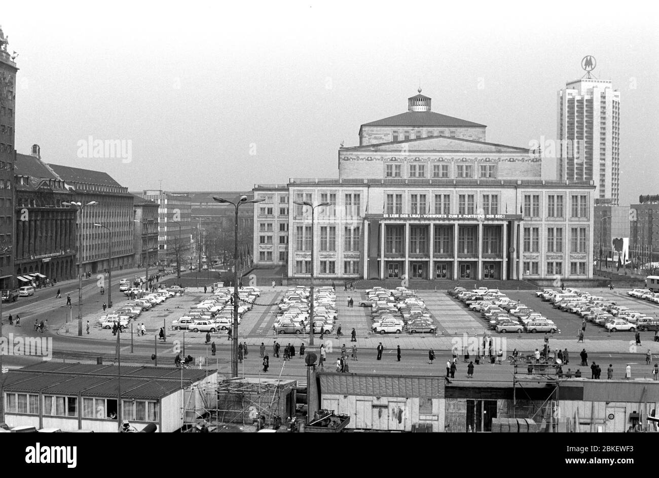 04 May 1980, Saxony, Leipzig: The Leipzig Opera House on Karl-Marx-Platz was built in 1954-1960 according to a design by Kunz Nierade and Kurt Hemmerling. On the right side in the back the Wintergartenhochhaus with the double MM of the Leipzig Fair. Photo: Volkmar Heinz/dpa-Zentralbild/ZB Stock Photo