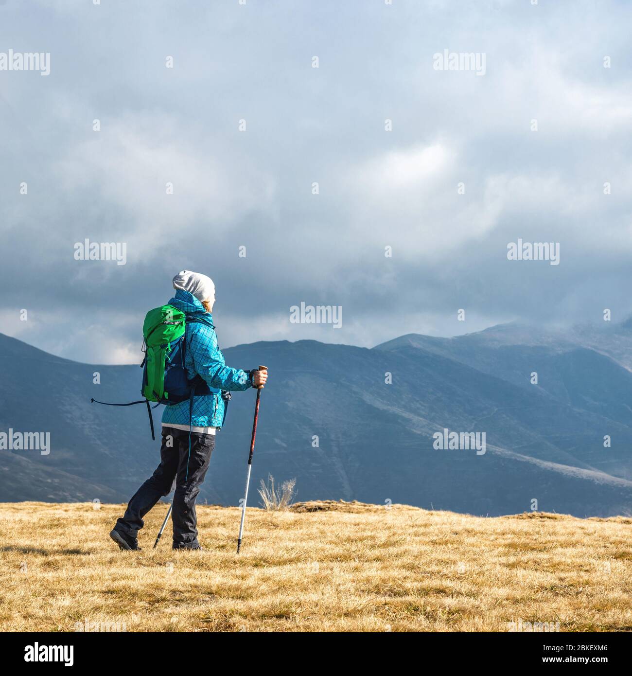 Young woman hiking in the mountains Stock Photo - Alamy