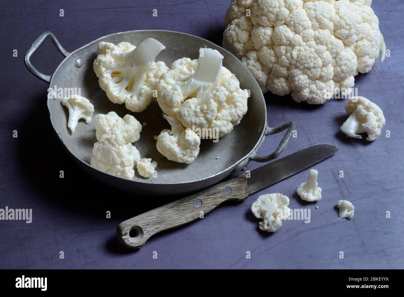 Cauliflower in bowl and knife, food photography, studio shot, Germany Stock Photo