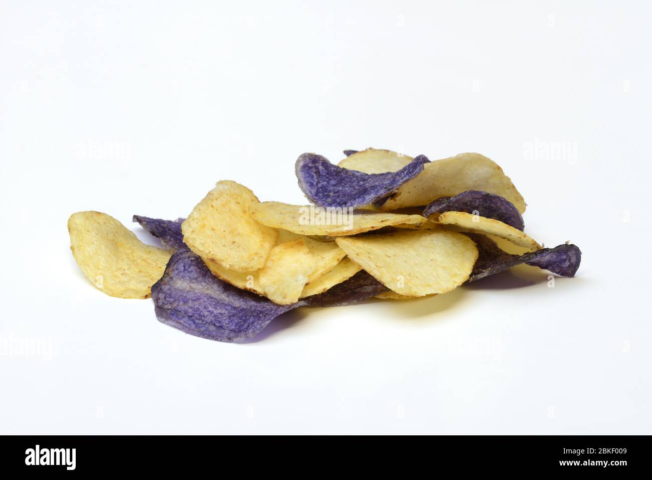 Different coloured potato chips, food photography, studio shot, Germany Stock Photo