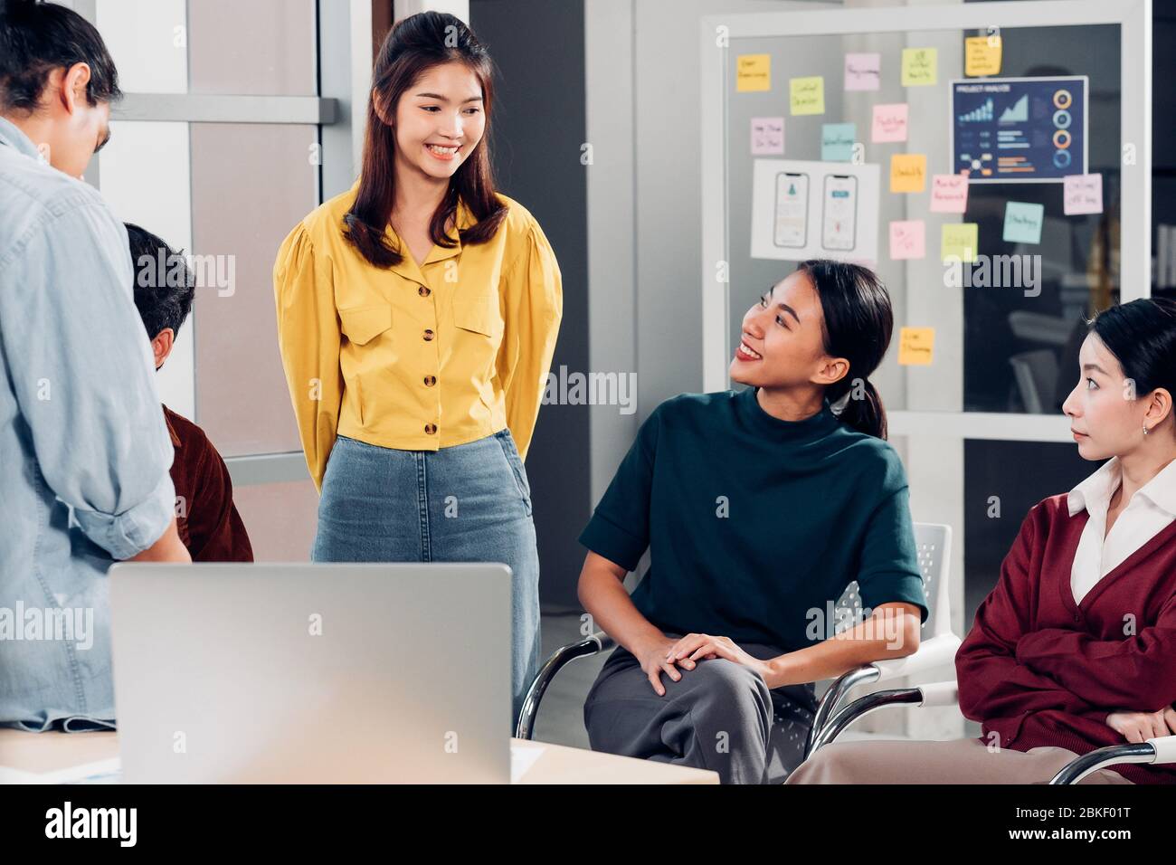 asian ux developer and ui designer casual meeting  about mobile app interface design on whiteboard in meeting at modern office.Creative digital develo Stock Photo