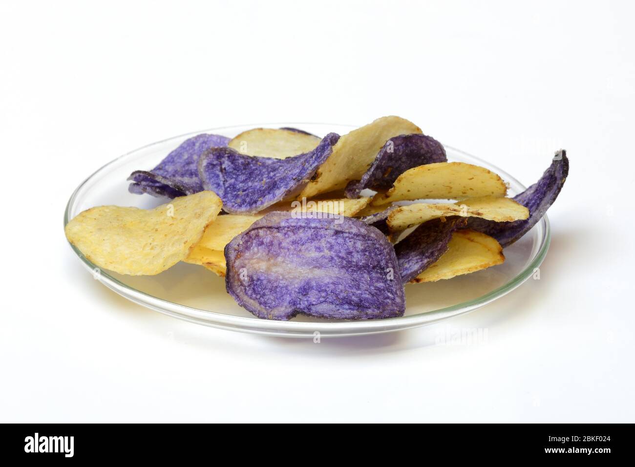 Potato chips on glass plate, food photography, studio shot, Germany Stock Photo