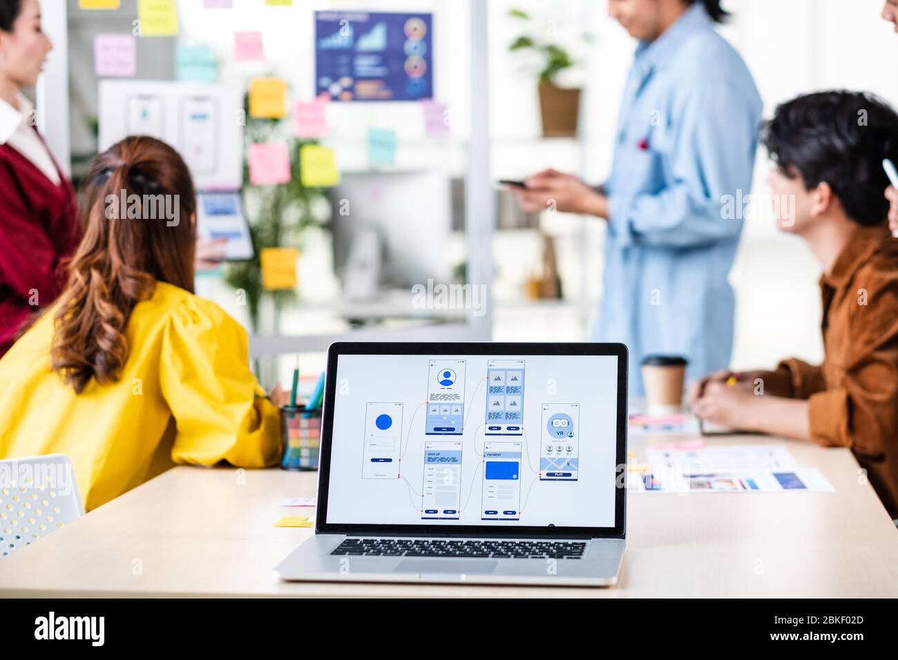 ux developer and ui designer presenting  and testing mobile app interface design on whiteboard in meeting at modern office.Creative digital developmen Stock Photo