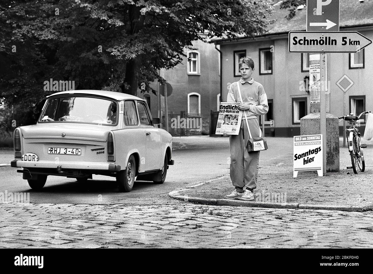 At last, the D-Mark is there, headline of the German newspaper Bild am Sonntag on the day of the monetary union of the FRG and GDR, a Trabant with Stock Photo