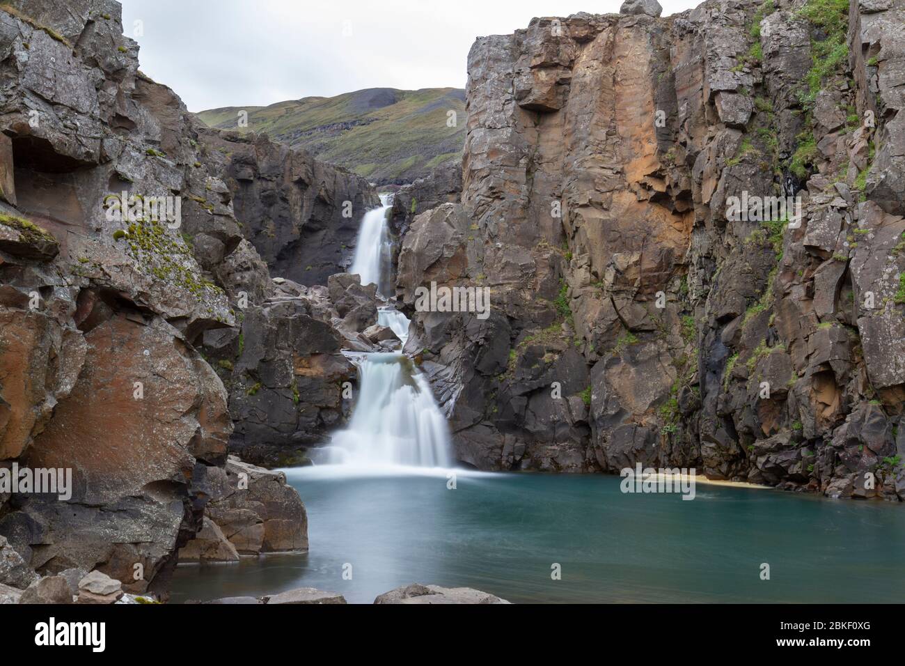 Long exposure of a double drop waterfall (unnamed) close to the Snæfellsstofa Visitor Center, Egilsstaðir, Iceland. Stock Photo
