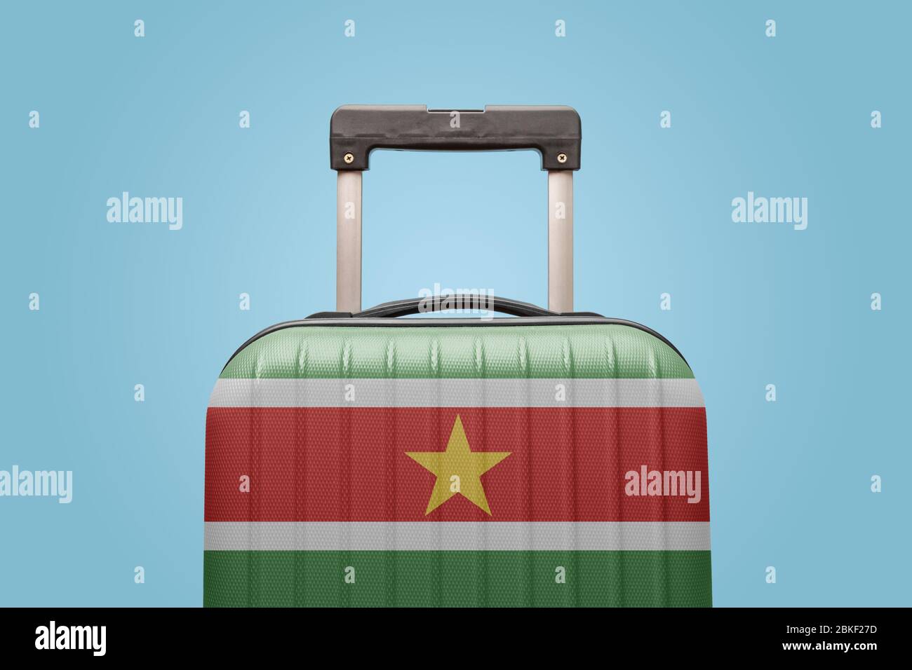Suitcase with Suriname flag design travel South America concept. Stock Photo
